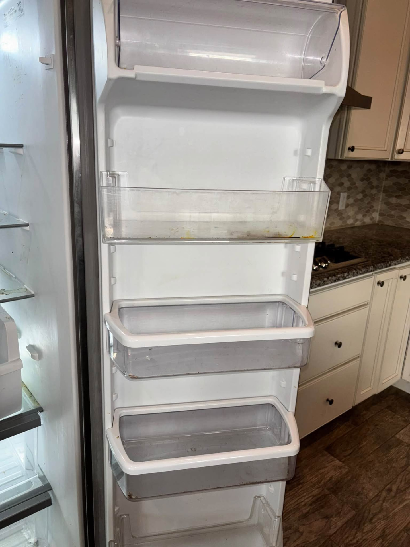 Refrigerator door bins before cleaning